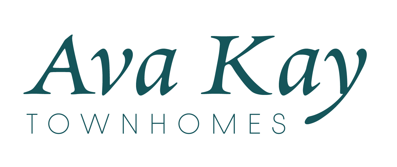 A green sign with the words Ava Kay Townhomes.